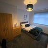 Photo 5: Cosy double bedroom with bedside storage and décor