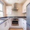 Photo 6: The kitchen is small, but there is a space for a dining table in the living room