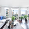Photo 2: Large living space with additional coffee table and dining area 