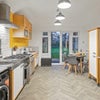 Photo 2: Bright, fully equipped kitchen-diner with direct garden access
