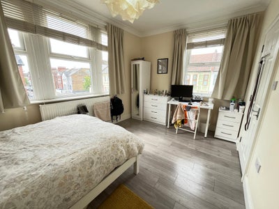 Large bedroom with private fridge in a clean home Main Photo
