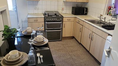 Spacious Hotel style furnished Rooms with TV.  Main Photo