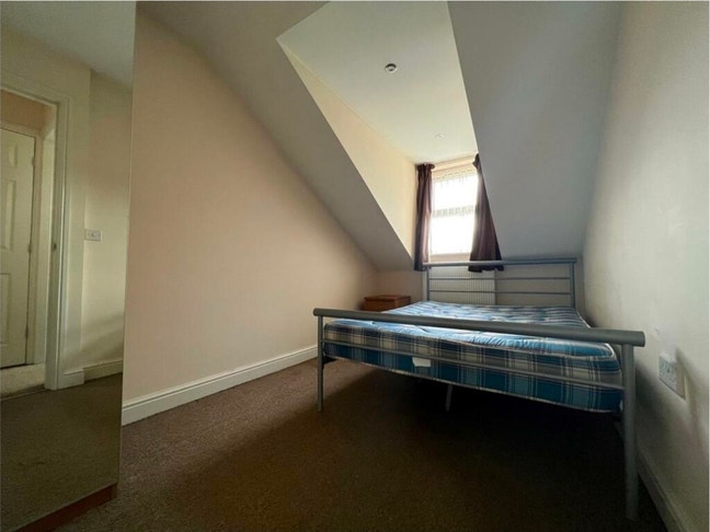 A double bed in a 4 bedroom apartment (loft area) Main Photo