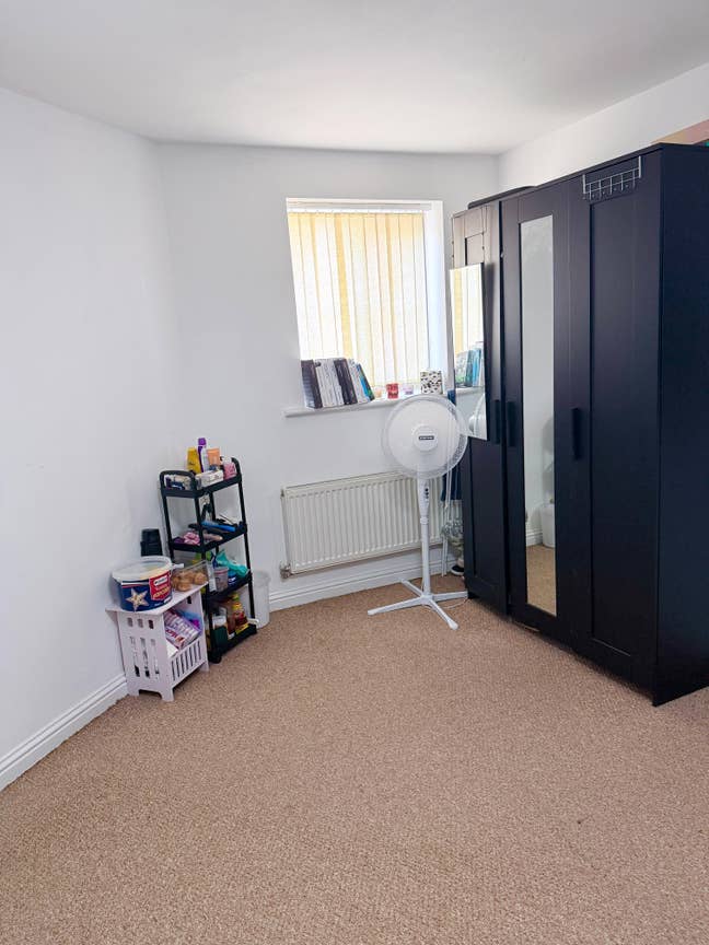 A clean, spacious, and well-maintained room is ava Main Photo
