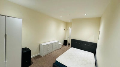 A spacious double room with attached bathroom. Main Photo