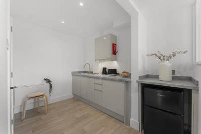 Now &pound;995 | Ground floor suite with own patio Main Photo