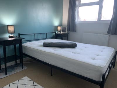 A bed & sitting room in a loft extension.  Main Photo