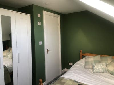 A newly refurbished attic bedroom with ensuite + a Main Photo