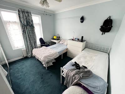 Two single beds in a double bedroom Main Photo