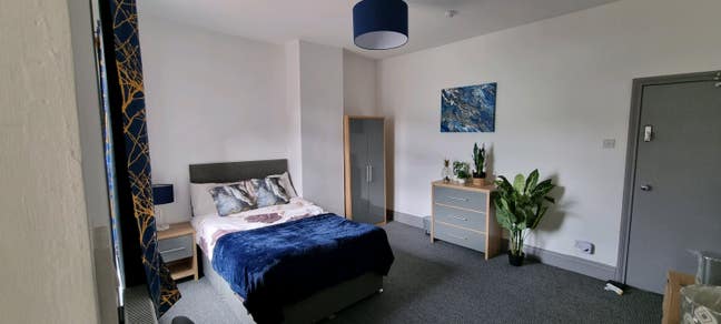 Modern room with own fridge freezer and TV Main Photo