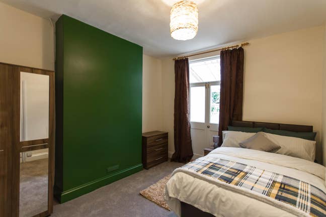 Large double bed with French Doors in Southville Main Photo