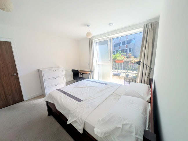 Large double bedroom bathed in sunlight  Main Photo