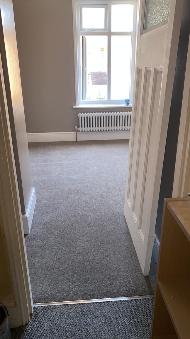 Single room with small double bed.  Main Photo