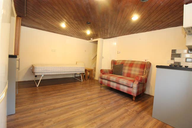 A studio apartment modern appliances and a separat Main Photo