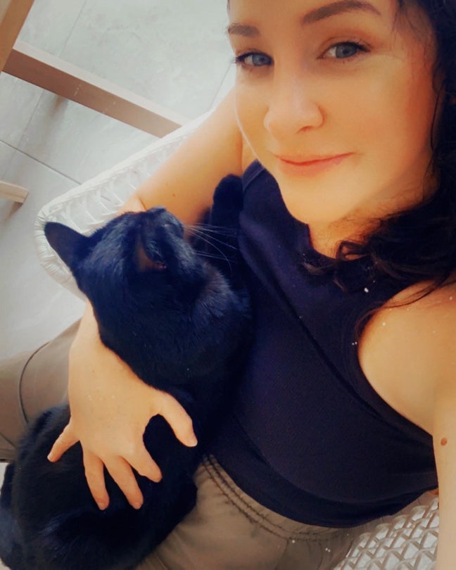 Lovely lady & her legendary black cat 🐾  Main Photo