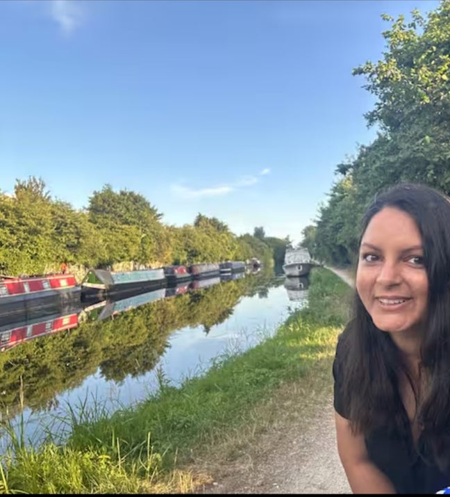 Scenic window view of the canal and boats. Main Photo