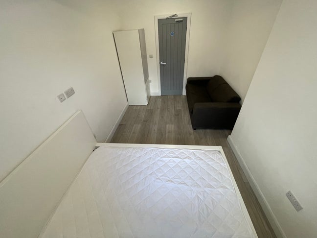 A bright, spacious studio-style room with its own  Main Photo