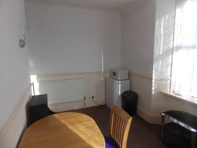Bedroom with ensuite and adjoining living room Main Photo