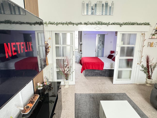 Massive bedroom with adjoining living room.  Main Photo