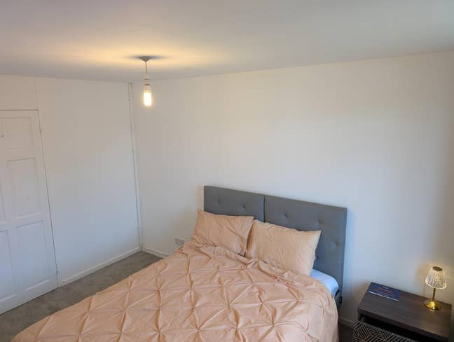 Clean spacious room with king-size bed.  Main Photo