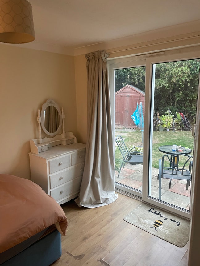 Single room with patio doors leading to garden. Main Photo