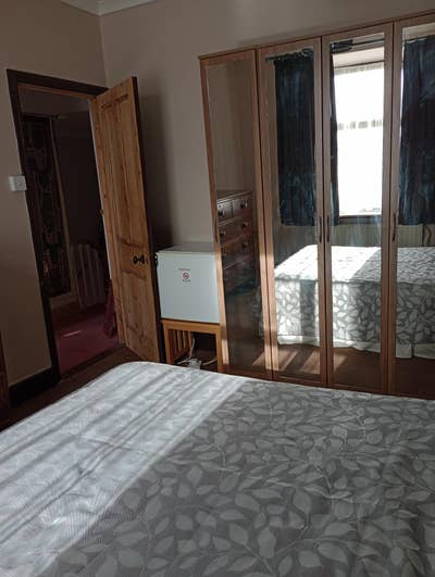 Fully furnished bedroom with adjacent sitting room Main Photo