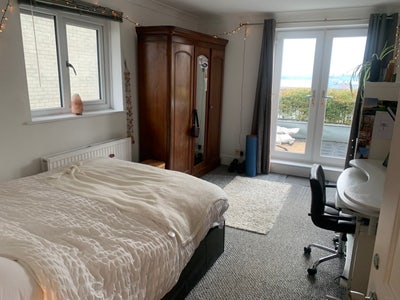 Large double bed with balcony view  Main Photo